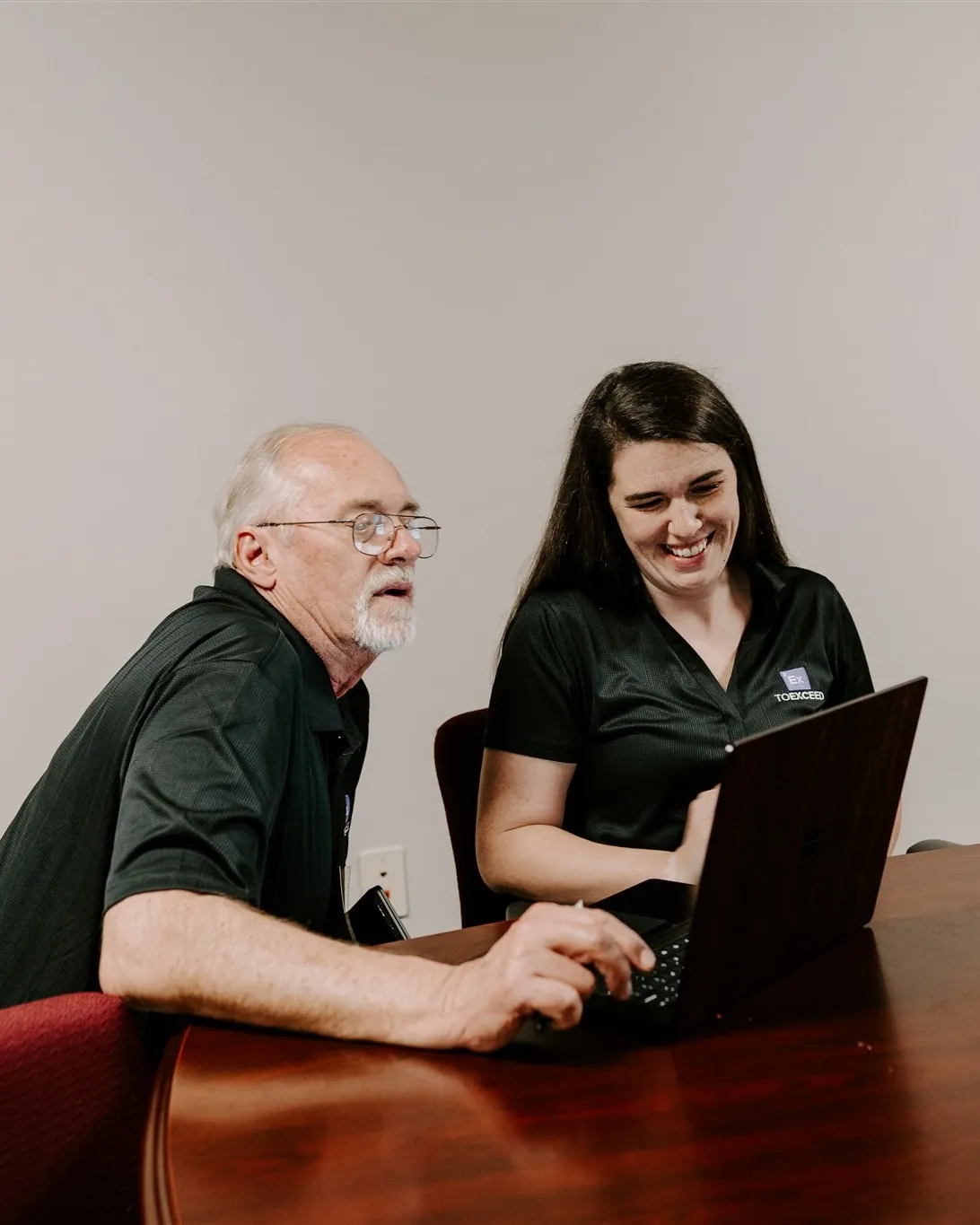 Dave and Becca from the To Exceed team reviewing campaign accountability reporting